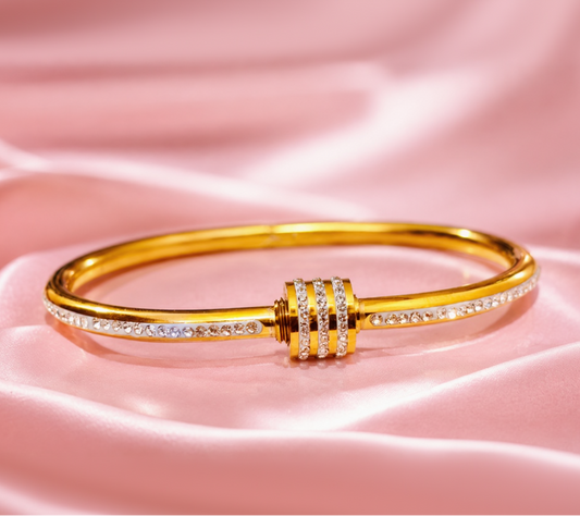 Gold bracelet with diamond accents on a pink satin background – Aurora 18K Gold Plated Demi-Fine Bracelet | Waterproof Gold Vermeil Jewellery for Women