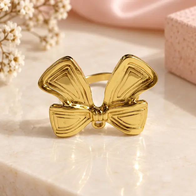 18K gold plated bow statement ring for women on luxury cream background – TVAYI