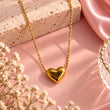 Amora Gold Plated Heart Necklace for Women on luxury baby pink background – TVAYI