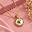 Amoura Gold Plated Heart Pearl Pendant Necklace on luxury pink background – TVAYI