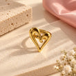 Amoura 18K Gold Plated Sculptural Heart Ring on premium cream background – TVAYI