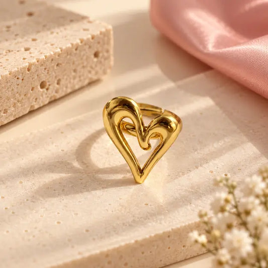 Amoura 18K Gold Plated Sculptural Heart Ring on premium cream background – TVAYI