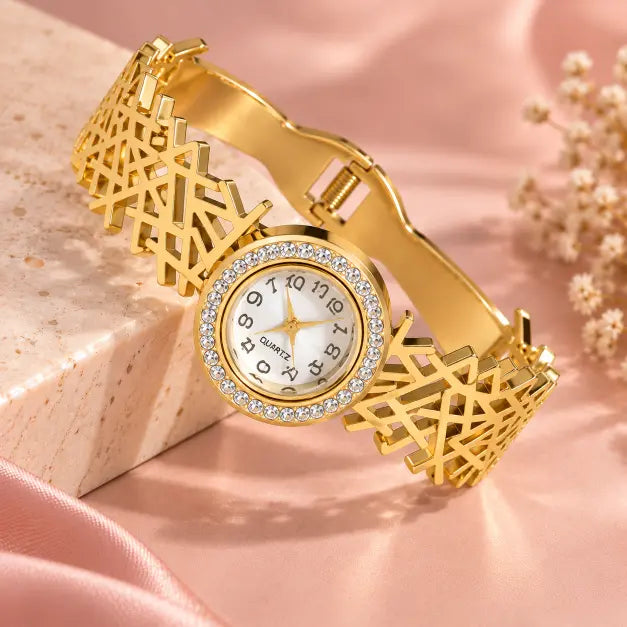 Aurelia Gold Plated Bracelet Watch detailed view showing geometric cutwork band and crystal bezel – TVA