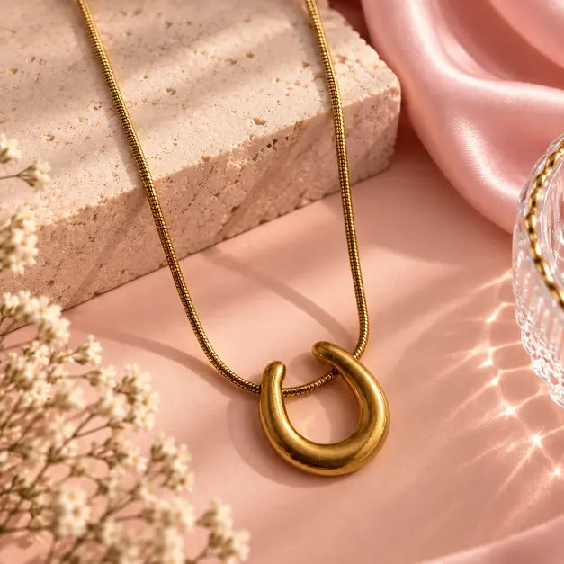 Aurevia Gold Plated Pendant Necklace for Women on luxury pink background – TVAYI