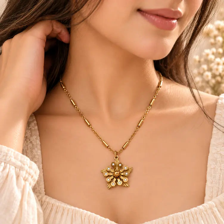 Woman wearing TVAYI Aurora Bloom floral gold necklace