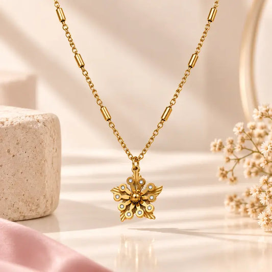 TVAYI Aurora Bloom 18K gold plated floral necklace on a premium cream background
