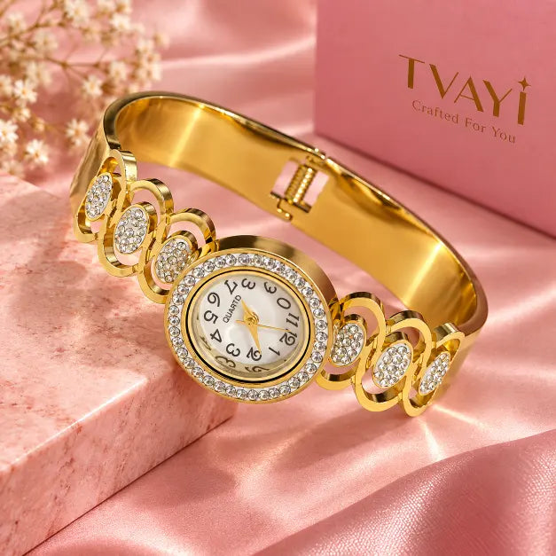 Celestia Gold Plated Crystal Bracelet Watch detailed oval link design on luxury pink background – TVAYI