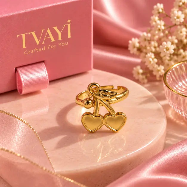 Close-up detail of Cerise Gold Plated Double Heart Charm Ring worn on finger – TVAYI
