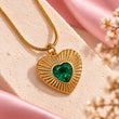 18K gold plated green heart pendant necklace with heart-shaped gemstone displayed on a premium cream background