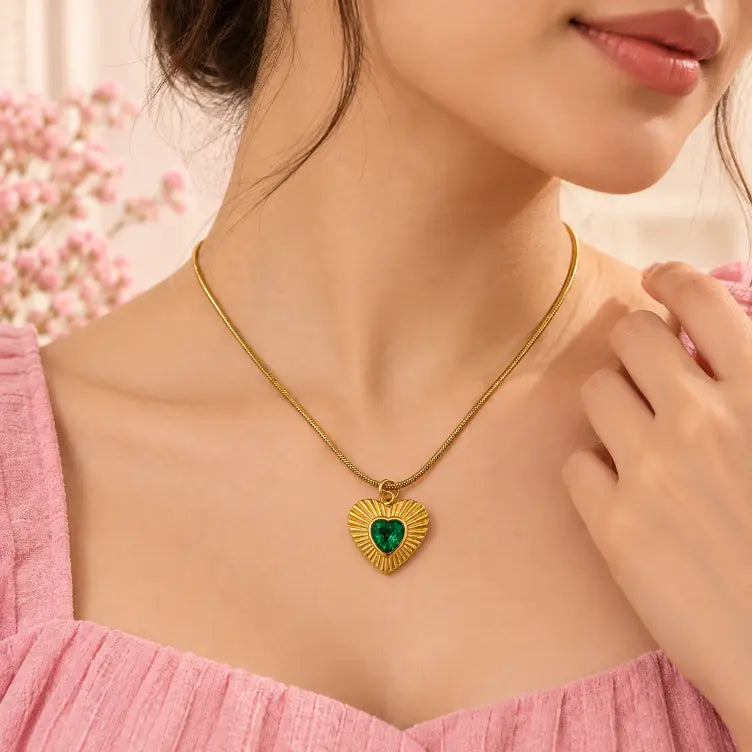 Woman wearing an elegant 18K gold plated green heart pendant necklace