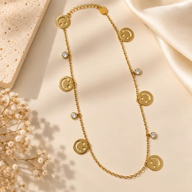 Happy Vibes 18K Gold Plated Smiley Charm Necklace on premium cream background – TVAYI