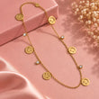 Happy Vibes Gold Plated Smiley Charm Necklace detailed view on luxury pink background – TVAYI