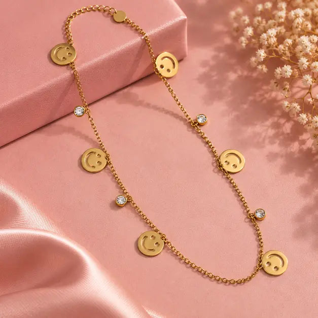 Happy Vibes Gold Plated Smiley Charm Necklace detailed view on luxury pink background – TVAYI