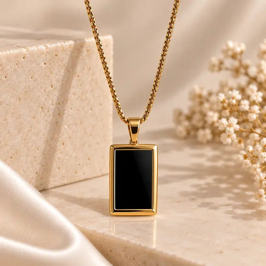 Noiré 18K Gold Plated Black Rectangular Pendant Necklace on premium cream background – TVAYI