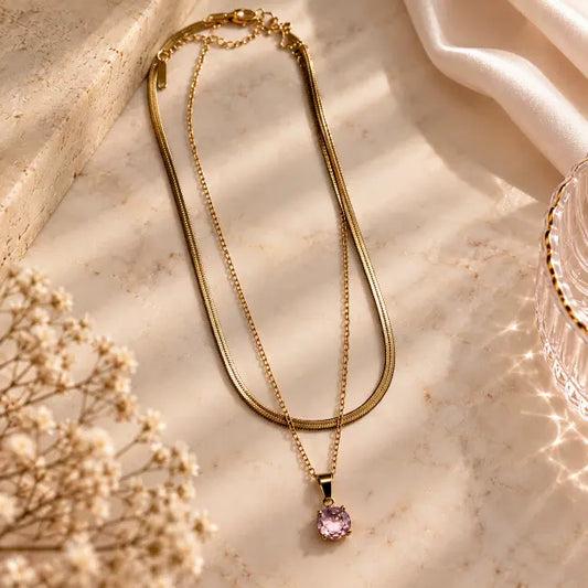 Roséa 18K Gold Plated Layered Necklace with Pink Stone Pendant on cream background – TVAYI