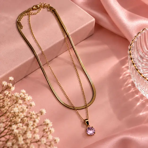 Roséa Layered Gold Necklace with Pink Pendant on premium baby pink background – TVAYI