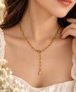 Woman wearing TVAYI Celeste Star Drop Necklace