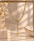 Close-up of 18K gold plated paperclip chain and plain gold star pendant
