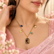 Woman wearing TVAYI Celeste Star Drop Necklace