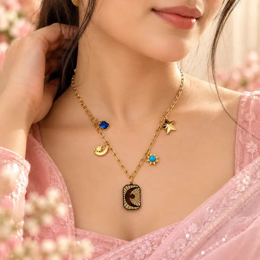 Woman wearing TVAYI Celeste Star Drop Necklace