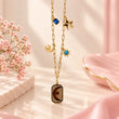 Close-up of 18K gold plated paperclip chain and plain gold star pendant
